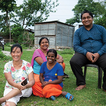 family sitting on lawn